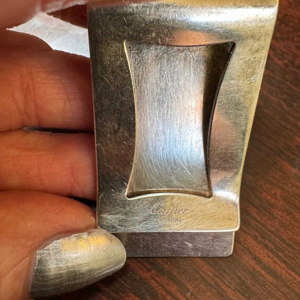 Cartier sterling silver money clip. Engraved with initials DLT.